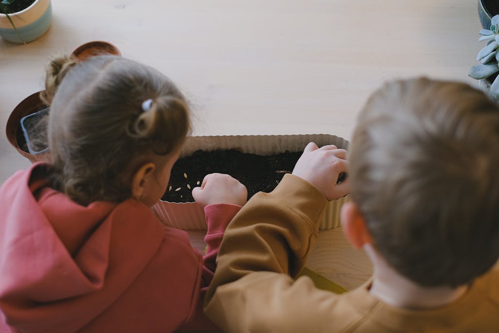 Boy and Girl Fixing a Pot